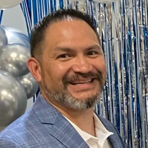 Photo of Ernesto A. Otero Jr., Retired Air Force and full-time grandfather, who shared a testimonial about Dr. Alisha Smith’s leadership, mentorship, humility, and grace.