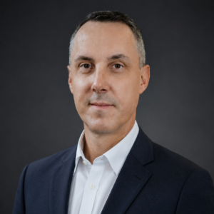 Professional portrait of Col Steven M. Fox, USAF 377 MDG, who shared a testimonial about Dr. Alisha Smith’s executive leadership, mentorship, and ability to balance analytical excellence with empathy.